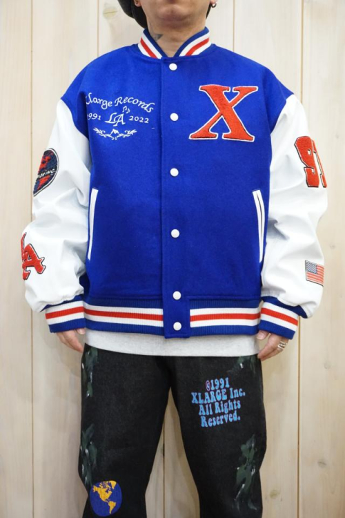 XLARGE 101224021007 OG LOGO VARSITY JACKET XLARGE スタジャン BLUE 正規通販 メンズ レディース